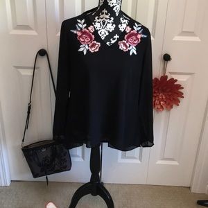Flowy black blouse with open back and back ties